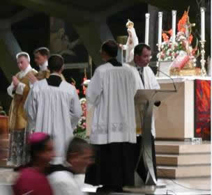 Father Cocault-Duverger announces the fusion procession together with the conciliar ones, at the end of the Mass