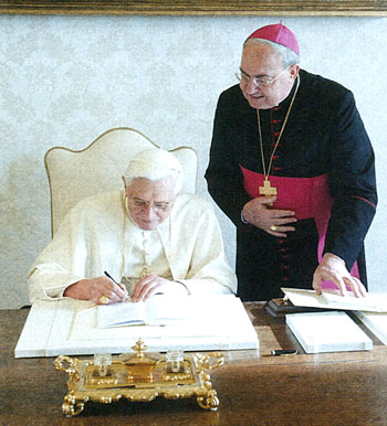 Benedict XVI signs the encyclical    Deus Caritas est ,